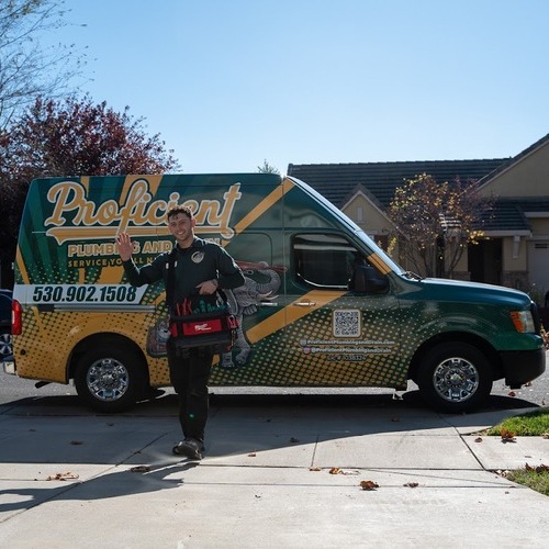 plumber standing in front of a truck